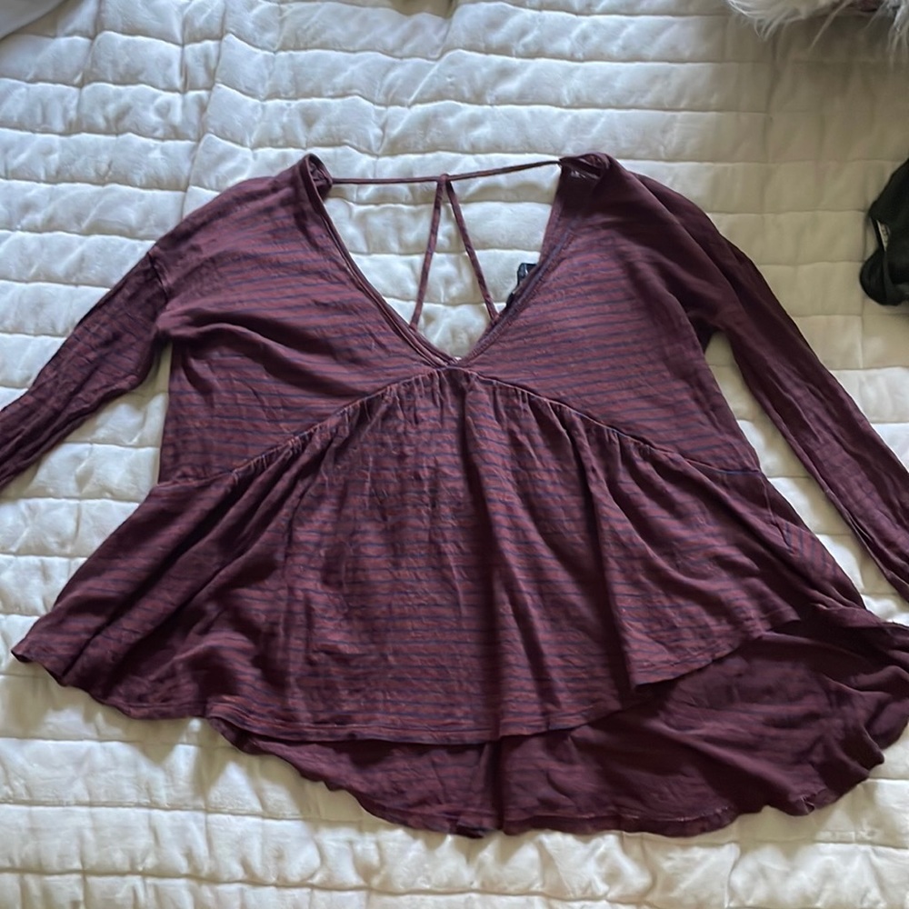A flowy purple shirt with blue stripes